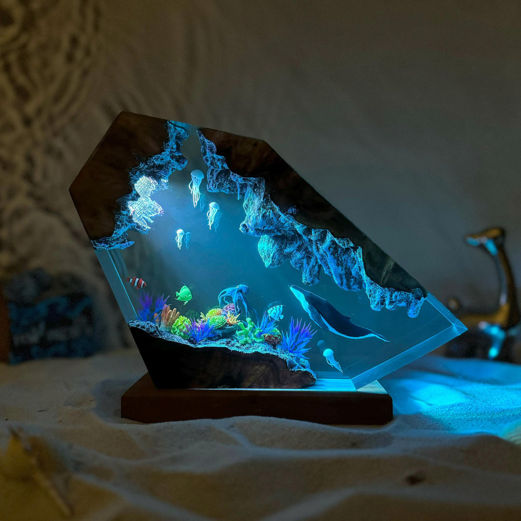 Reef Lamp — a coral shelf and a whale cast in epoxy resin on a wood base, lit from below