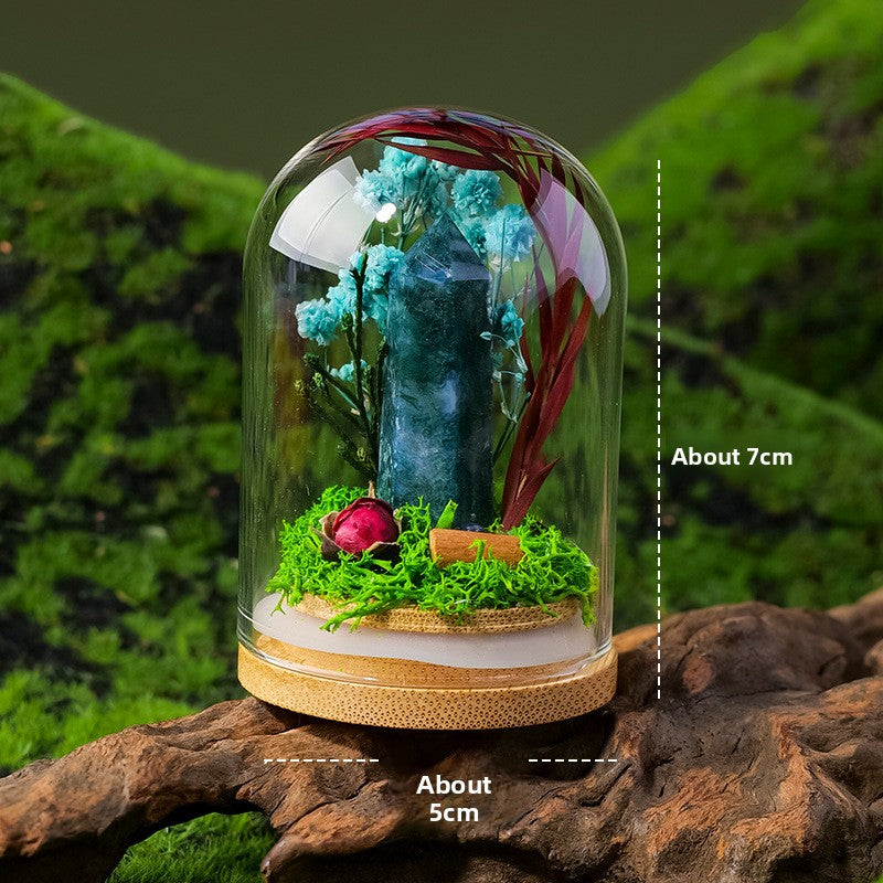 Crystal Dome — a raw crystal standing in preserved moss on a turned wood base, under a glass dome