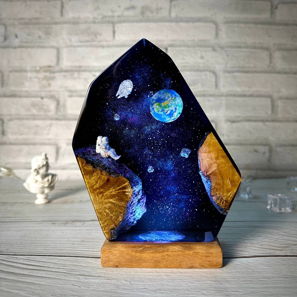 Earthrise Lamp — the Earth rising over a resin galaxy on a wood base, lit from below