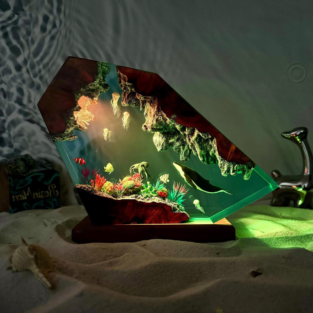 Reef Lamp — a coral shelf and a whale cast in epoxy resin on a wood base, lit from below