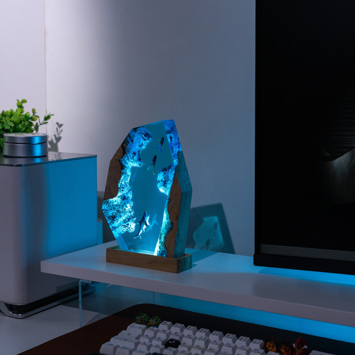 Diver Lamp — two divers and a shark in open blue water, cast in resin between two pieces of wood
