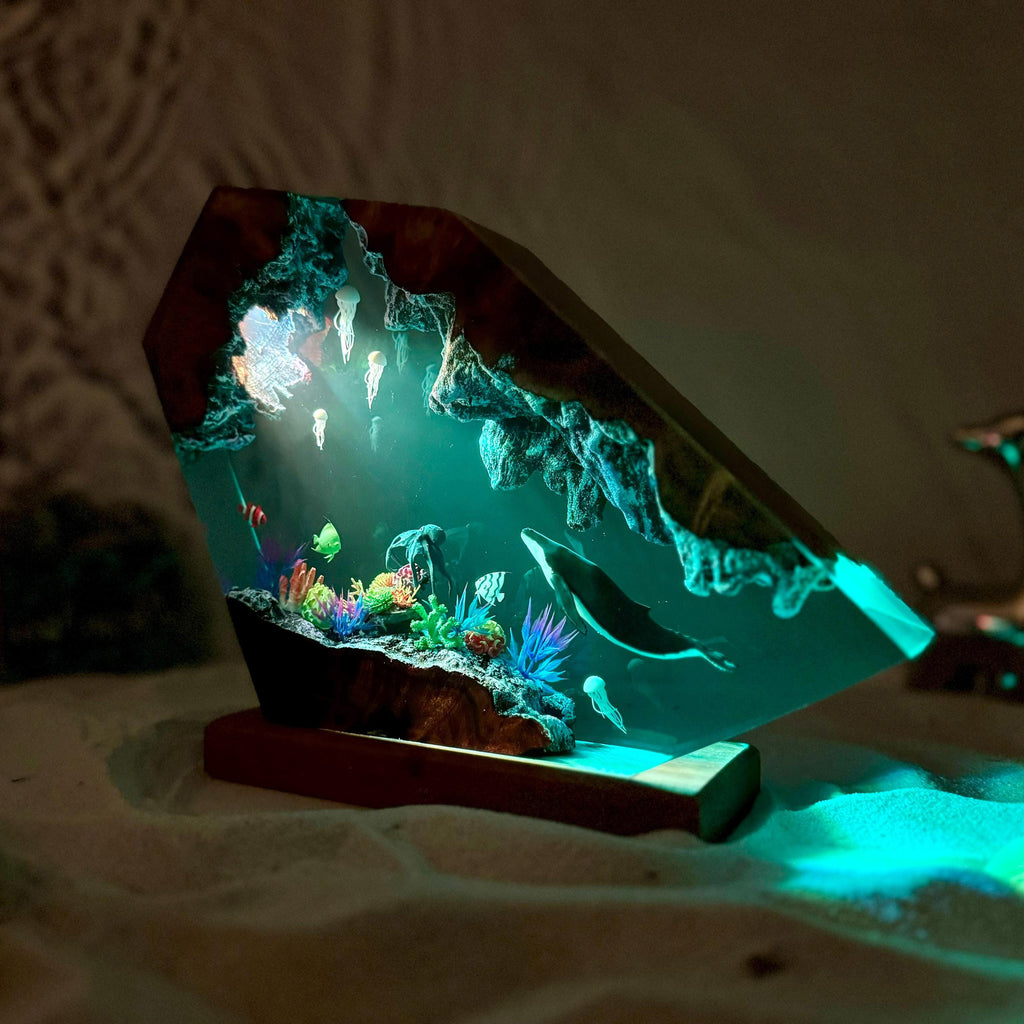 Reef Lamp — a coral shelf and a whale cast in epoxy resin on a wood base, lit from below