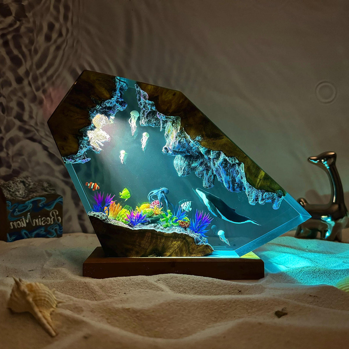 Reef Lamp — a coral shelf and a whale cast in epoxy resin on a wood base, lit from below