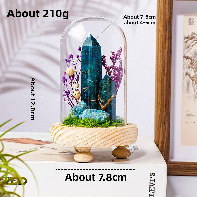 Crystal Dome — a raw crystal standing in preserved moss on a turned wood base, under a glass dome