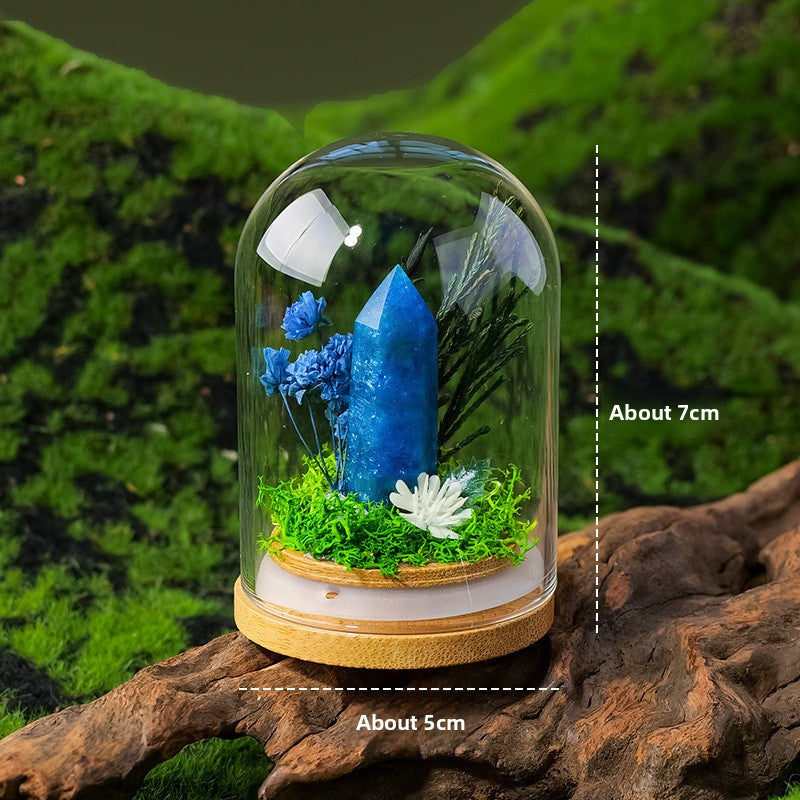 Crystal Dome — a raw crystal standing in preserved moss on a turned wood base, under a glass dome